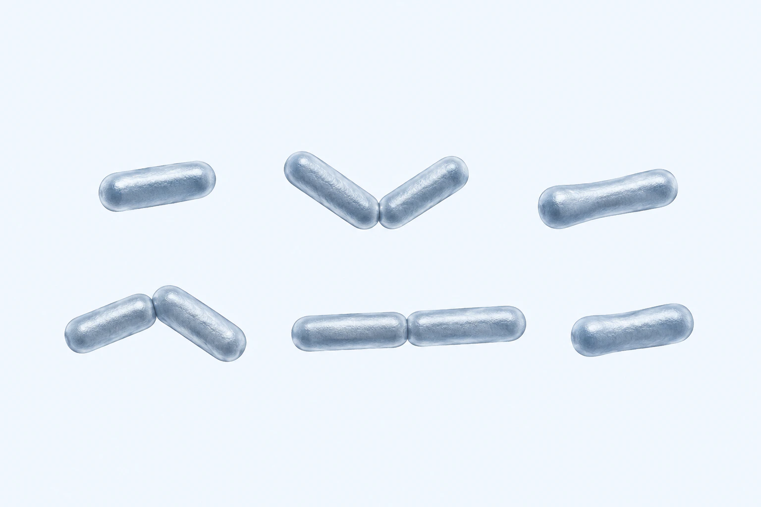 Nine mildly pleomorphic Propionibacterium rods appear in six groups: three singles and three touching pairs in shallow V, angled, and end-to-end arrangements.